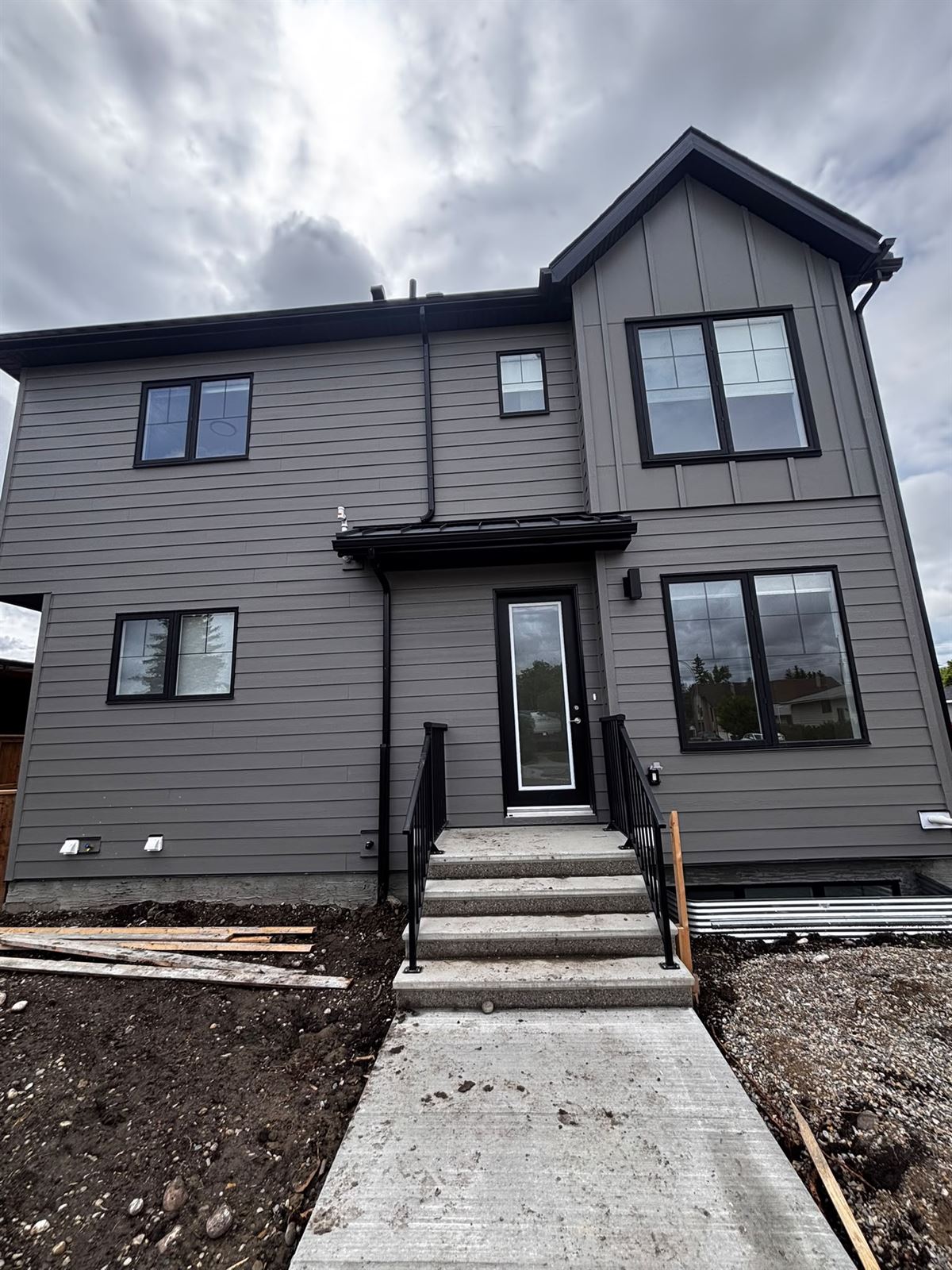 Completed rear elevation with lap and board-and-batten siding