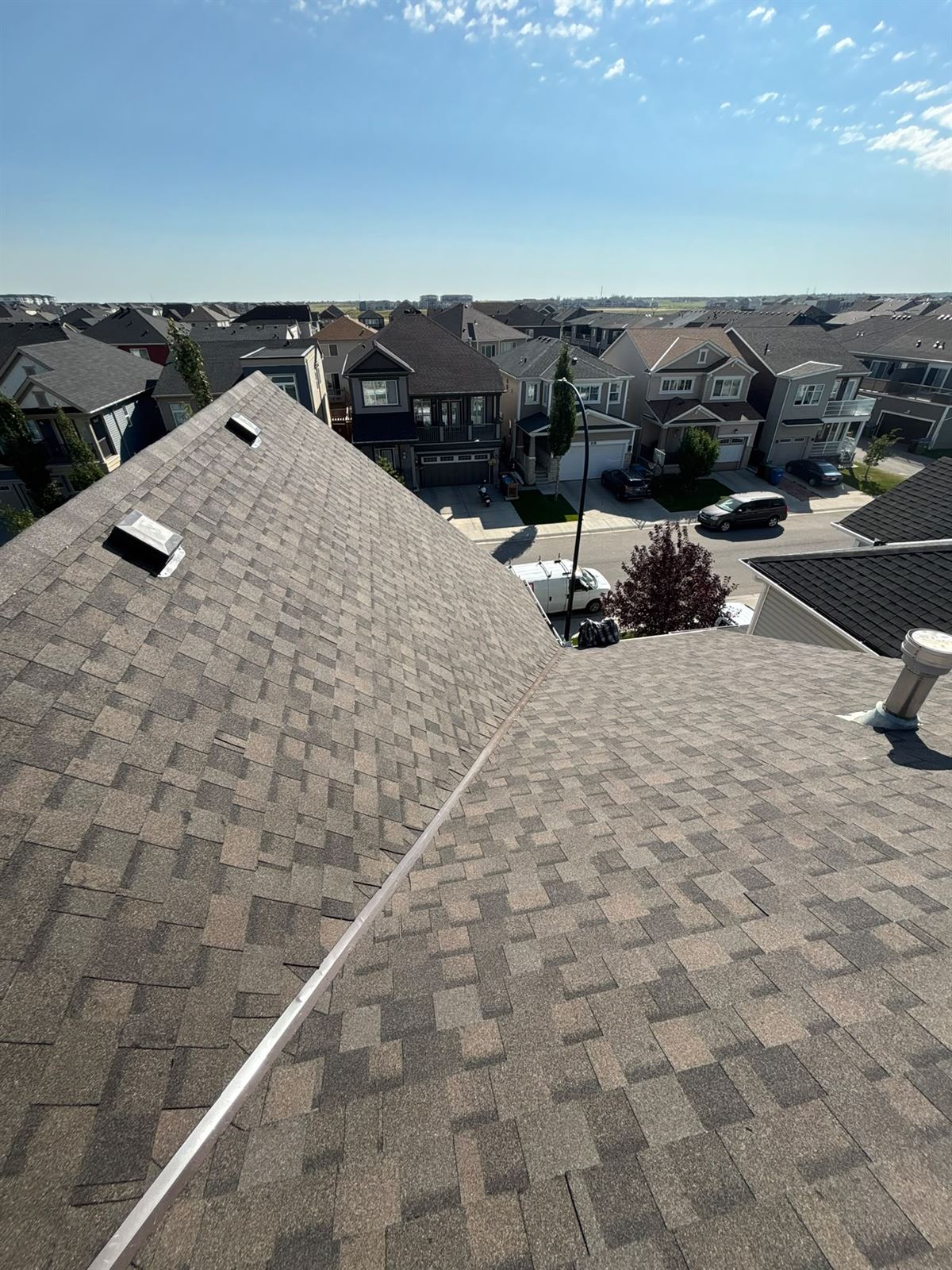 Completed brown architectural shingle roof