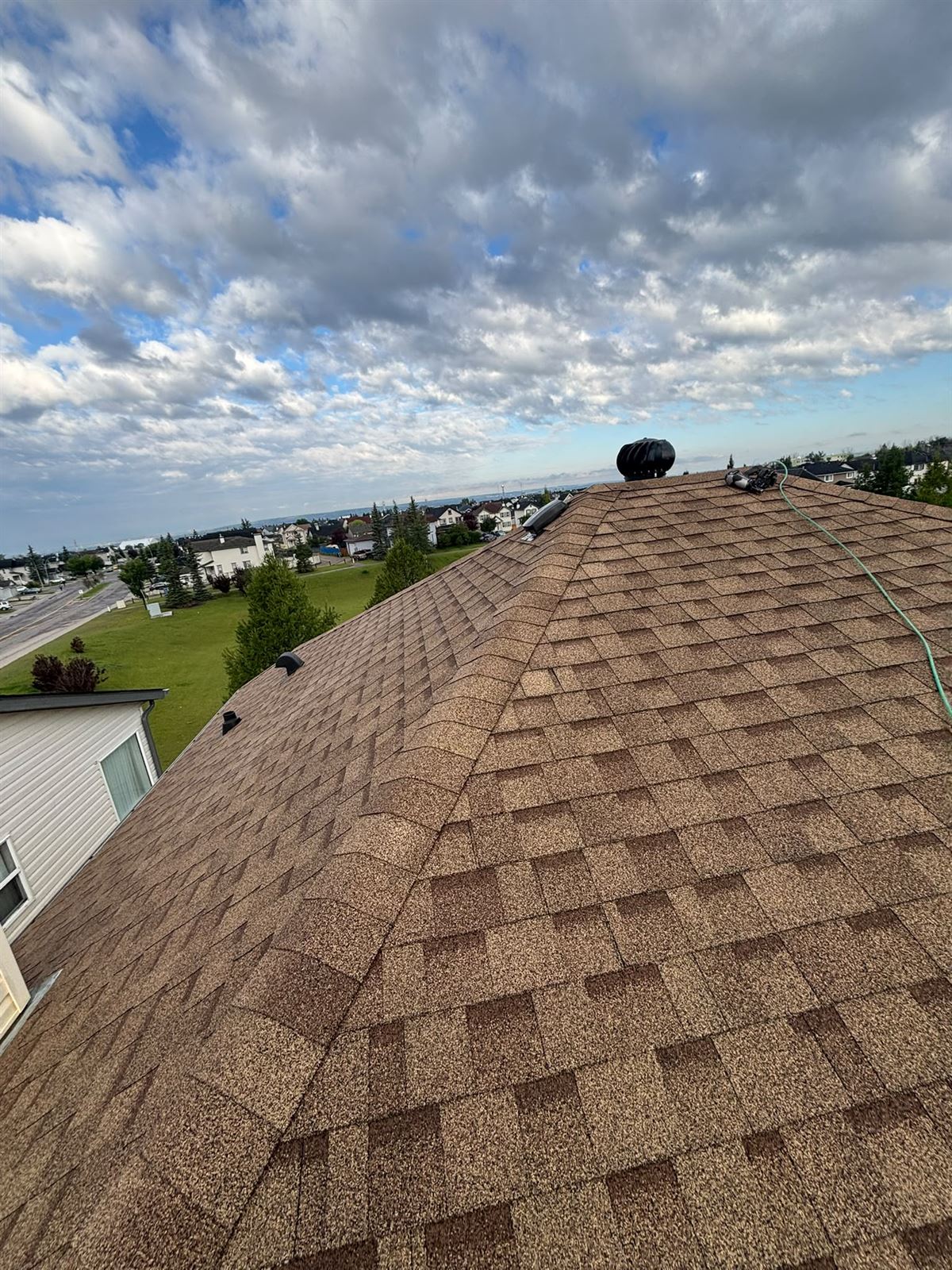 Completed hip roof overlooking a Calgary green space