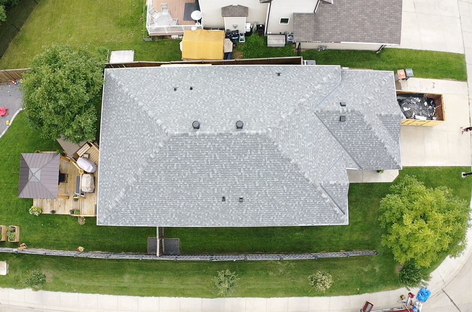 Completed shingle roof replacement seen from above