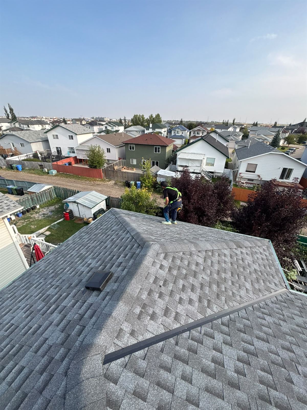 Freshly shingled roof on a Calgary two-storey home