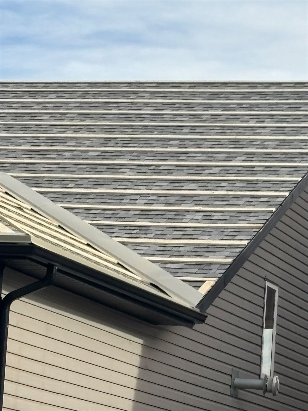 Completed shingle slope with new roof vents