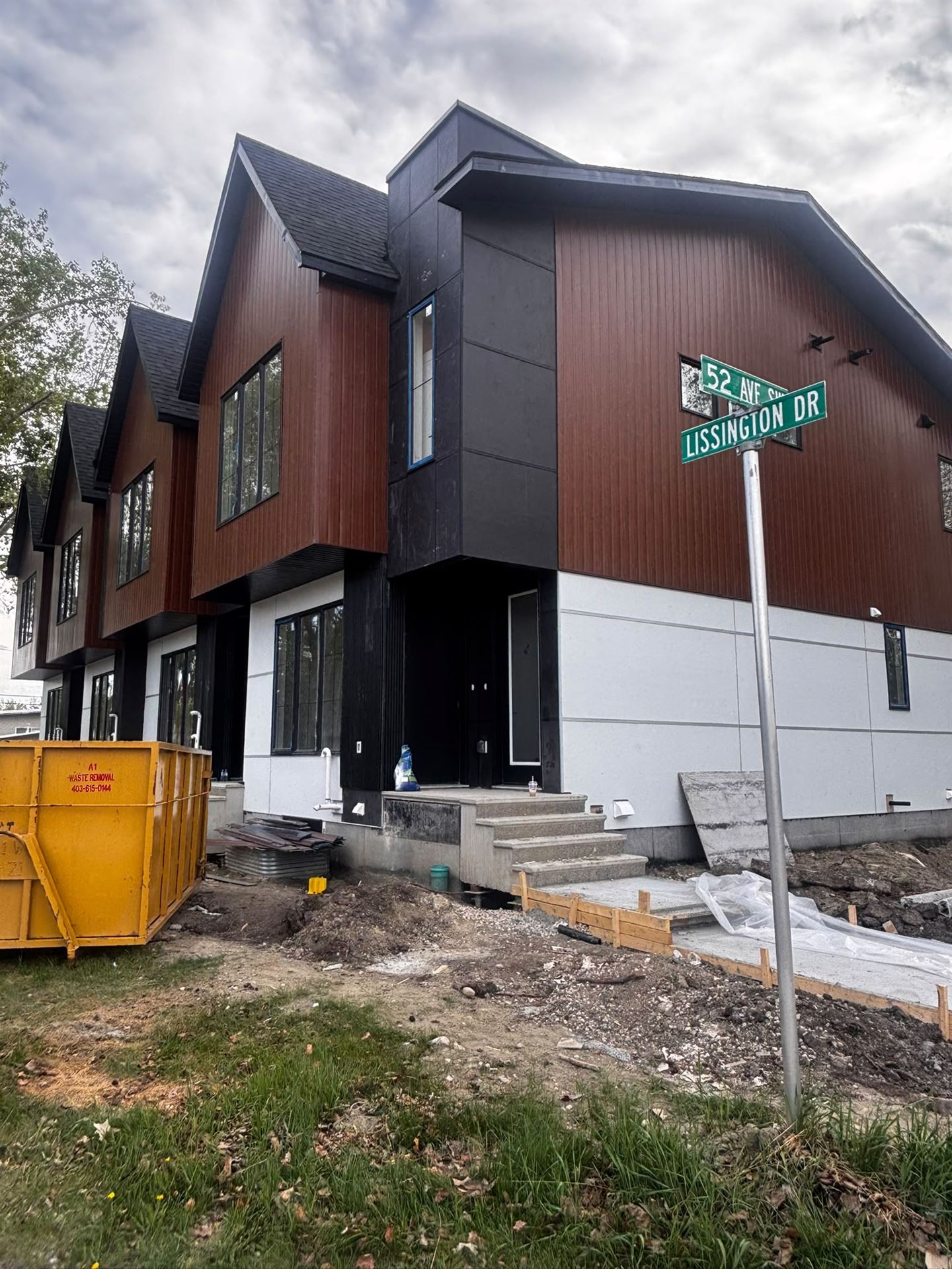 New Silverstone-sided townhomes at the corner of 52 Avenue SW in Calgary